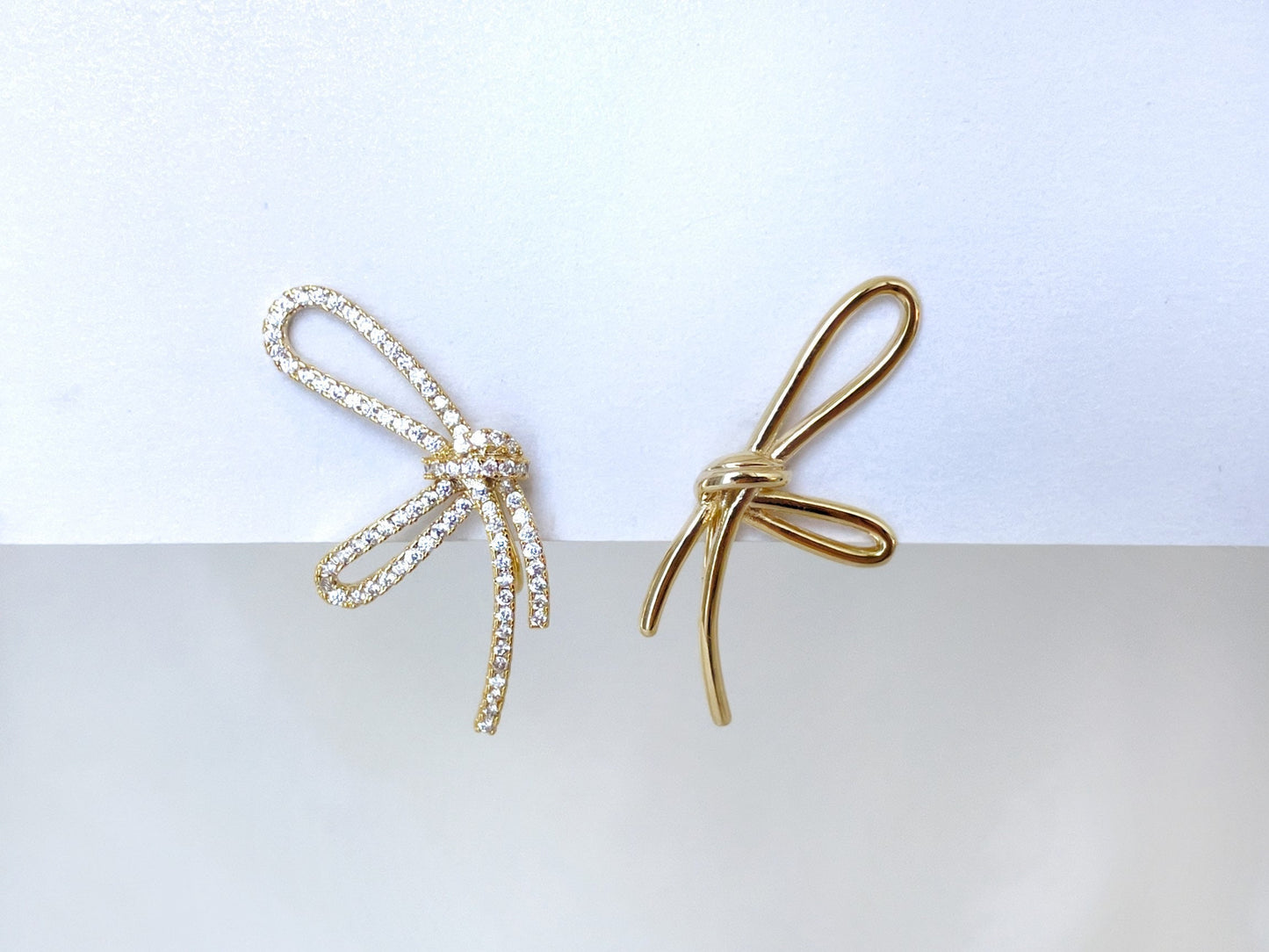 Mismatched sparkly bowknot clip on earrings