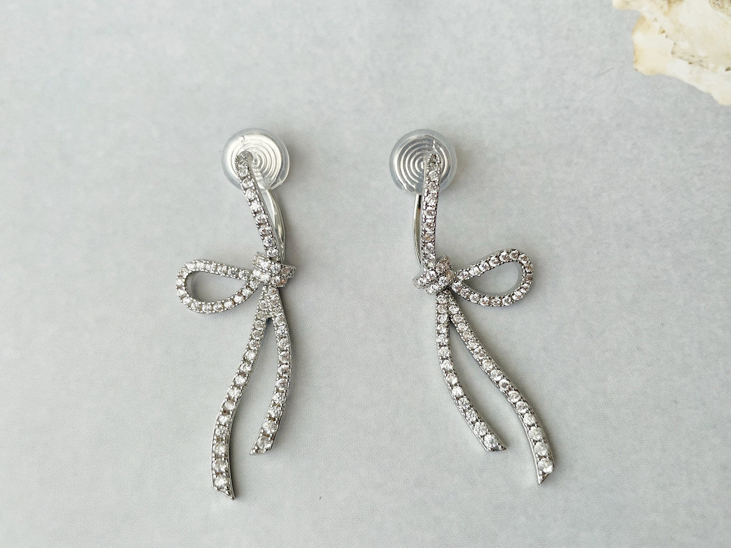 Sparkling CZ Crystal Ribbon Bow Silver Dangle Clip on Earrings