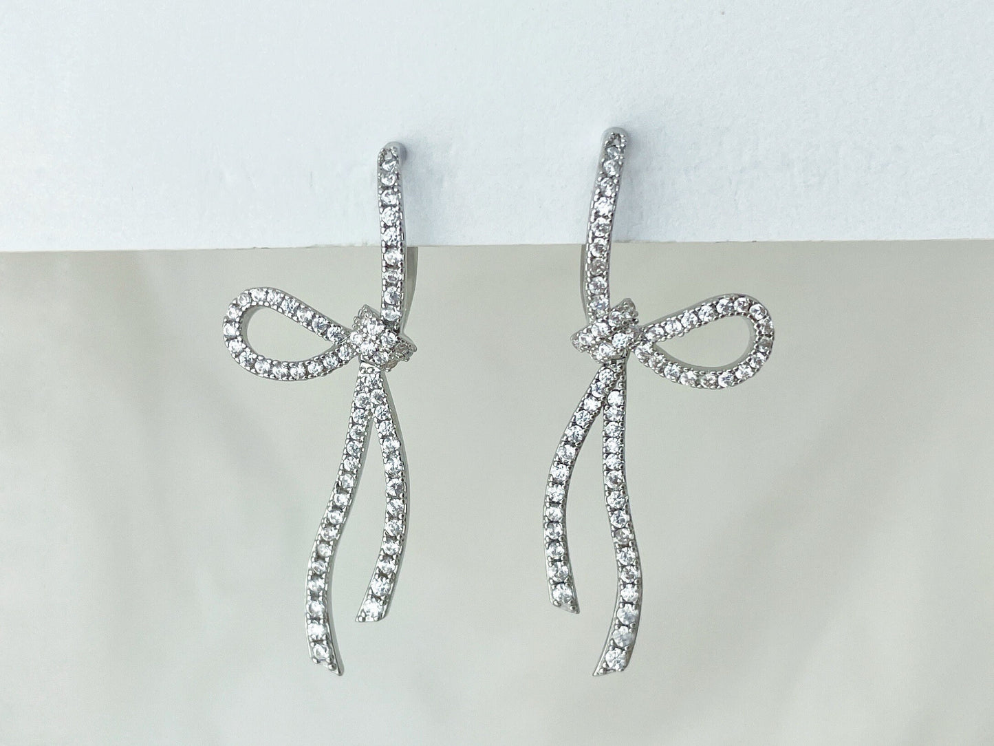 Sparkling CZ Crystal Ribbon Bow Silver Dangle Clip on Earrings
