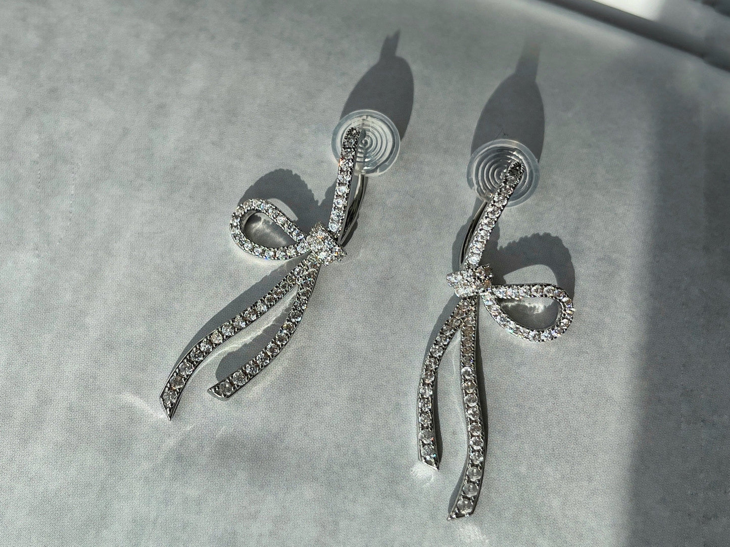 Sparkling CZ Crystal Ribbon Bow Silver Dangle Clip on Earrings