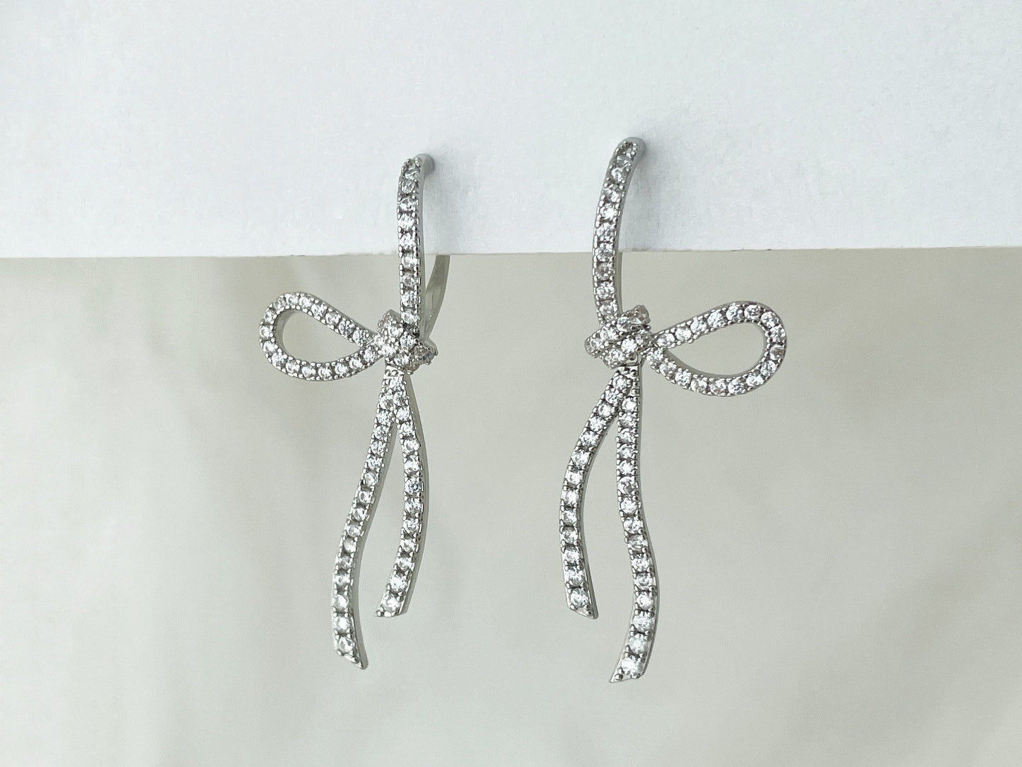 Sparkling CZ Crystal Ribbon Bow Silver Dangle Clip on Earrings